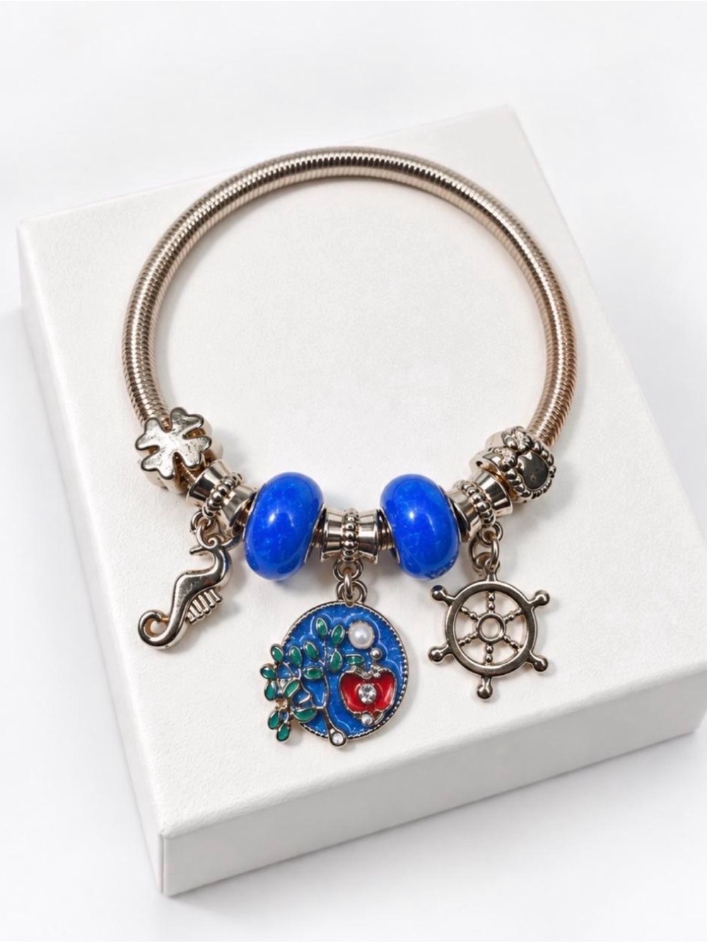 Silver Charm Bracelet with Bright Blue Glass Beads and Nautical Heart Pendant